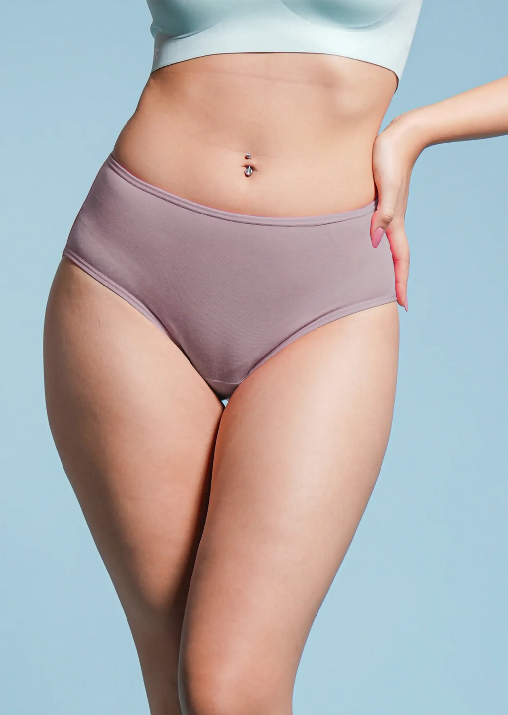Person wearing a pair of purple underwear against a light blue background