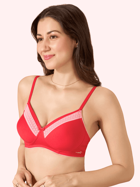 Woman wearing a red bra with pink accents on a white background