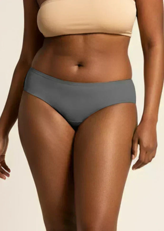 Person wearing gray underwear on a beige background