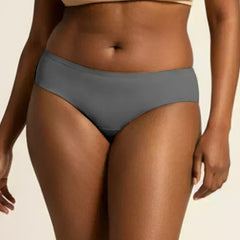 Person wearing gray underwear on a beige background