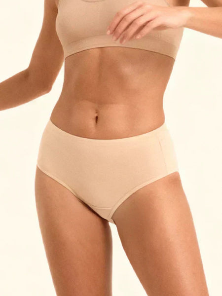 Beige mid-waist underwear on a plain background