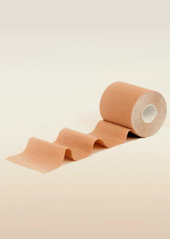 Roll of beige tape on a beige background