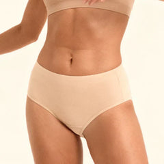 Beige mid-waist underwear on a plain background
