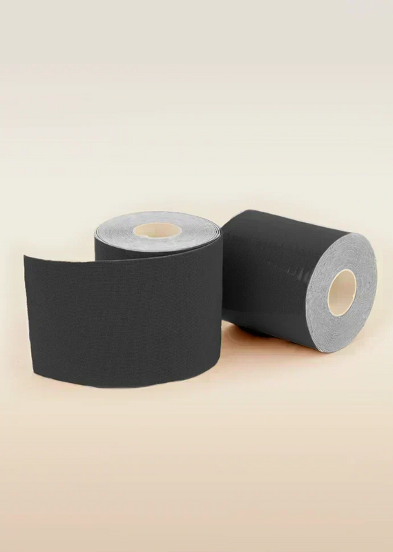 Two rolls of black tape on a beige background