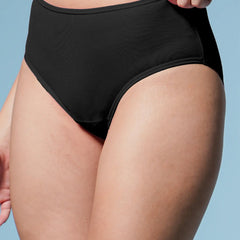 Person wearing black high-waisted underwear against a light blue background