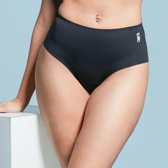 Person wearing black mid-waist underwear on a light blue background