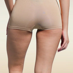 Beige boyshorts worn by a person on a beige background