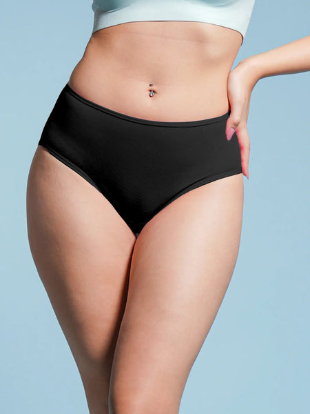 Person wearing black high-waisted underwear on a light blue background