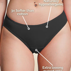 Black underwear with text highlighting features on a beige background