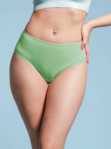 Person wearing green underwear against a light blue background