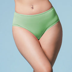 Green high-waisted underwear worn by a person on a light blue background