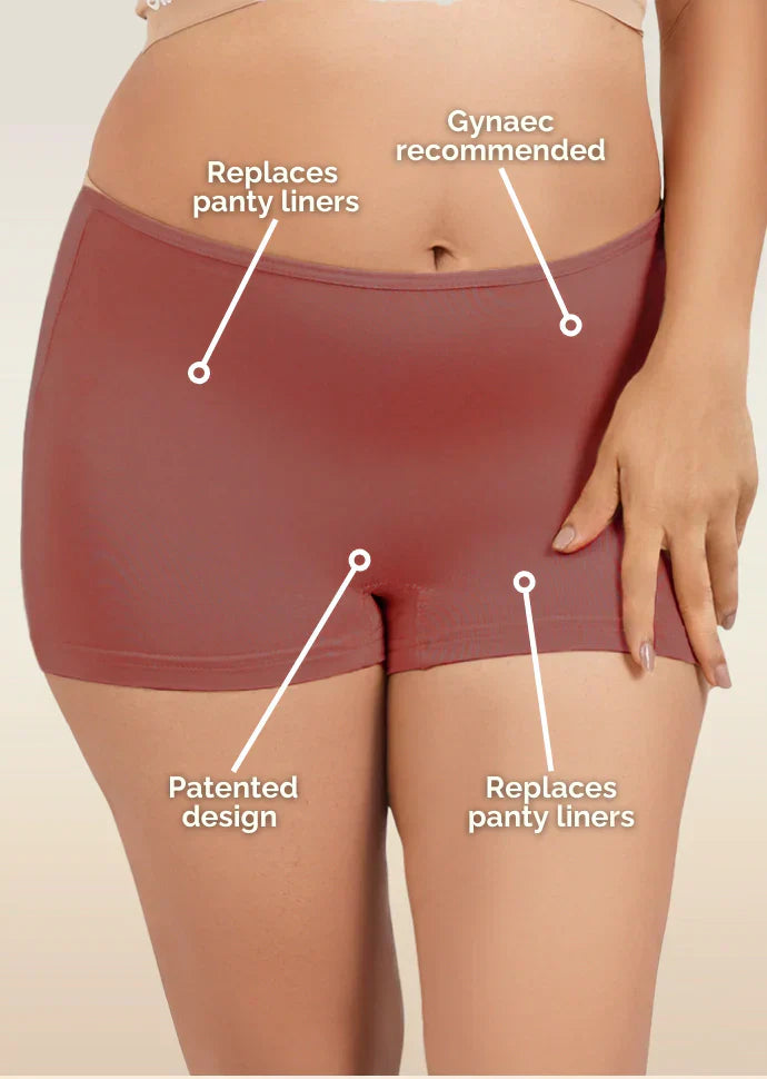 red women's boyshorts with text highlighting features on a beige background