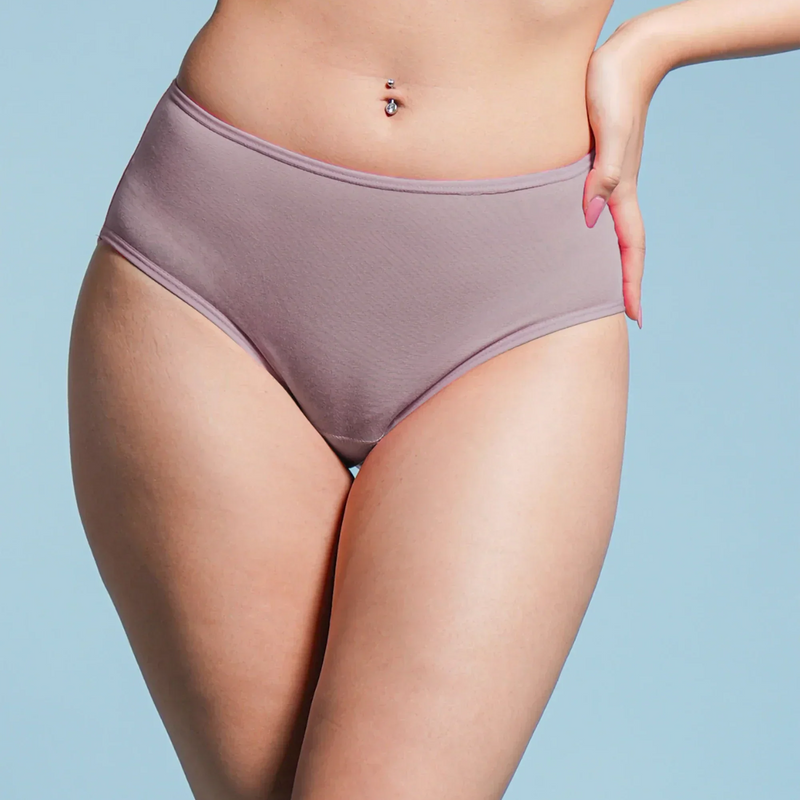 Person wearing a pair of brown underwear against a light blue background