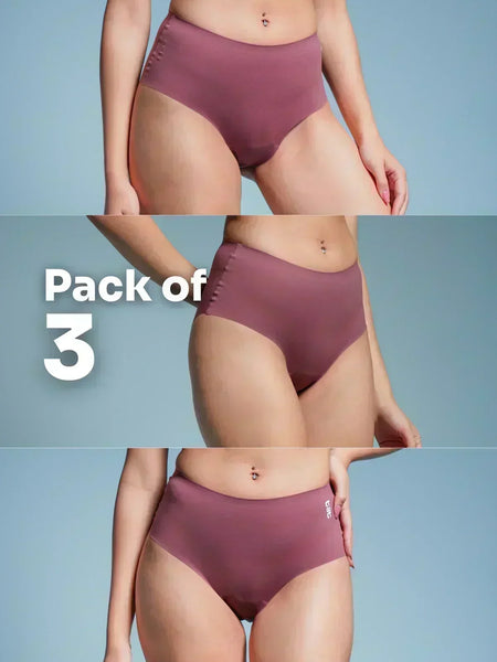Three-pack of pink underwear on a plain background