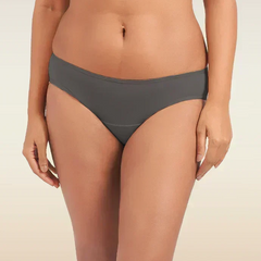Person wearing gray underwear on a beige background