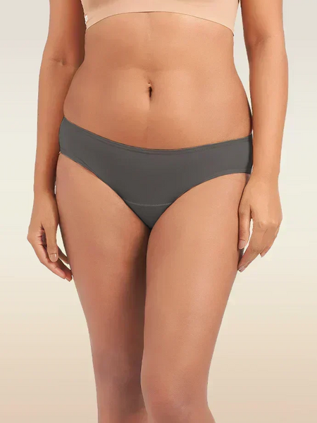 Person wearing gray underwear on a beige background